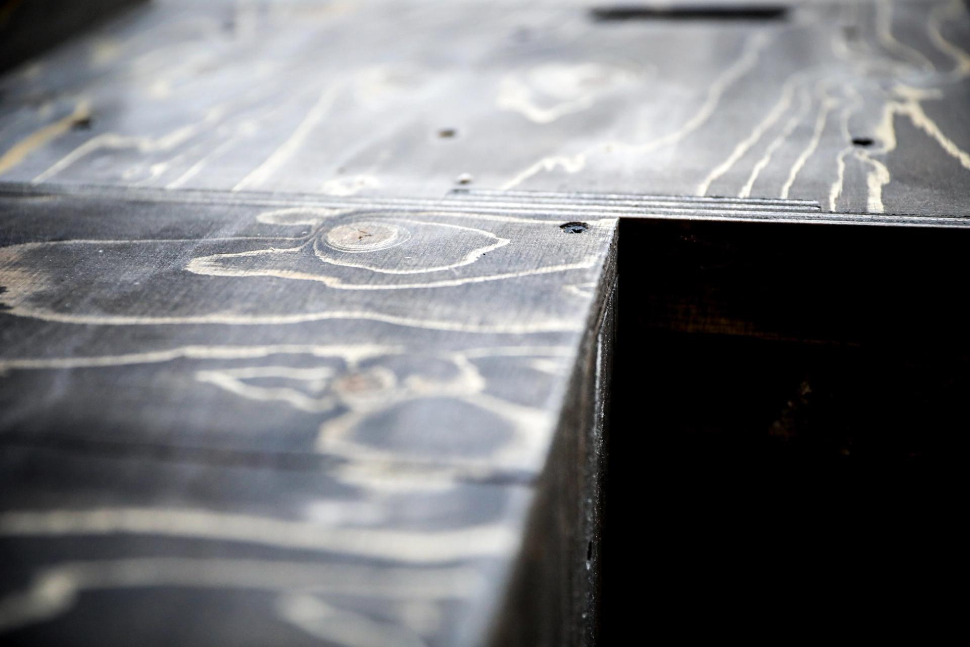 Image of modular pre-fabricated boxes painted black