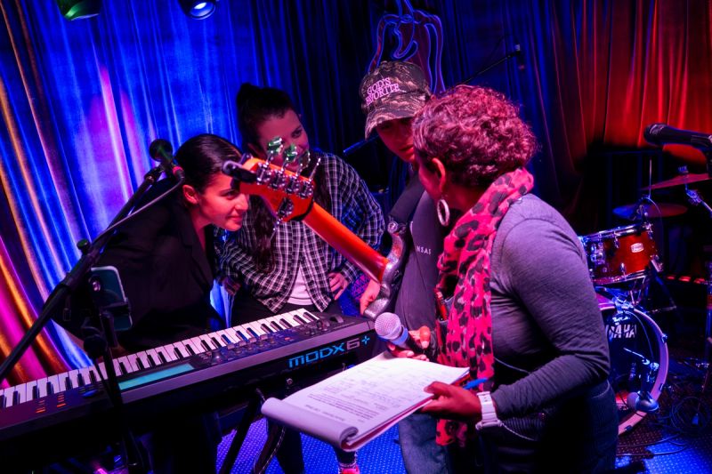 sound sorcery team and band members discussing on stage 