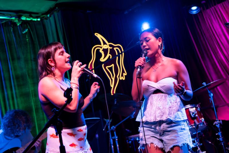 two jammers together on stage singing