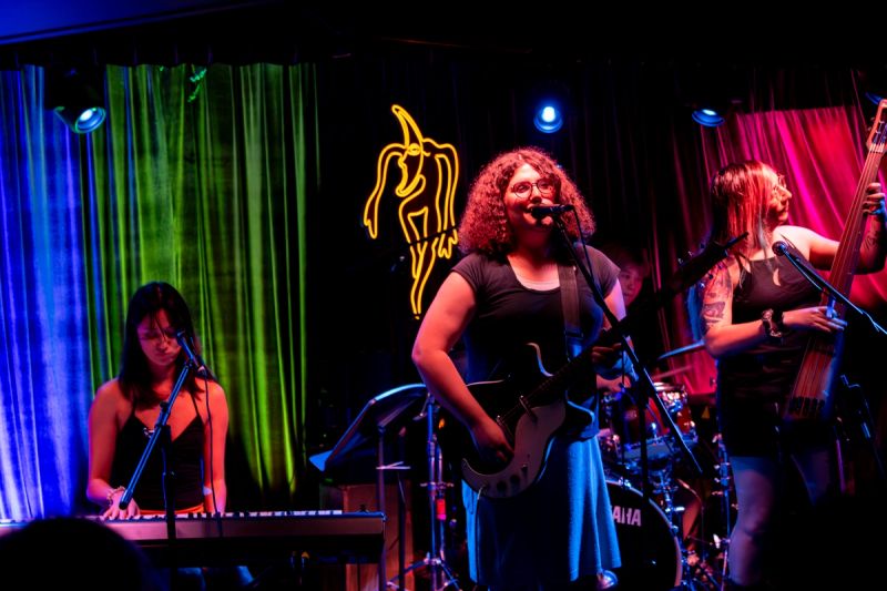 Miss Emilia and band on stage performing