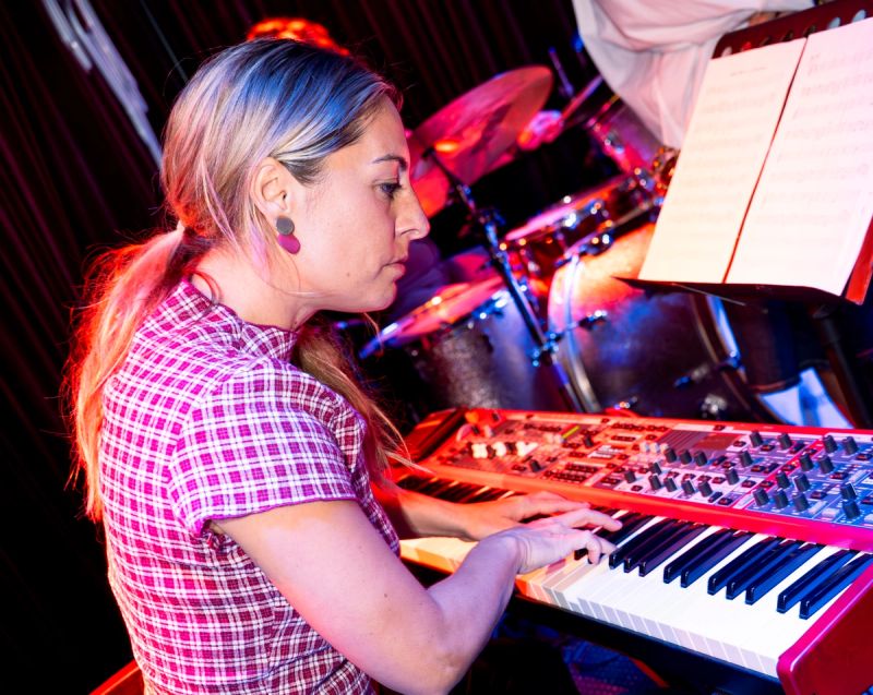 close up of keys player, looking down playing