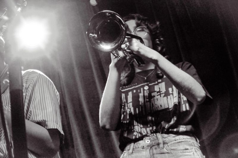 person playing trumpet, close up shot