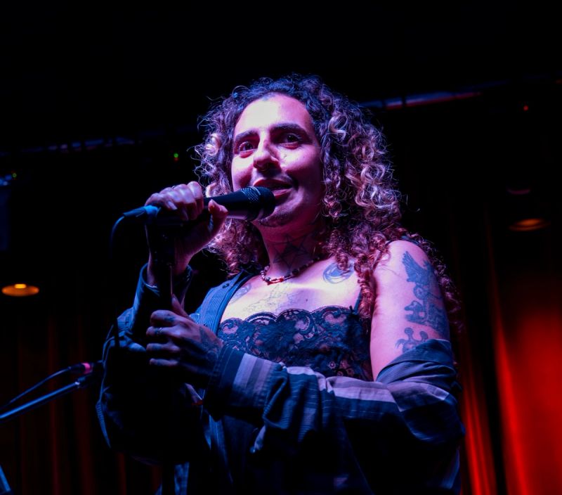 imbi speaking into microphone