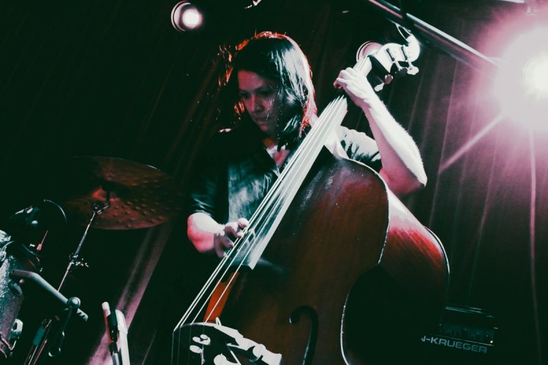 picture taken from below of double bass player whilst playing