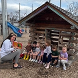 A child's mother reading to children at a Little Wonders Early Learning Center location. (Photo Courtesy of Little Wonders Early Learning Center)