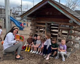 A child's mother reading to children at a Little Wonders Early Learning Center location. (Photo Courtesy of Little Wonders Early Learning Center)