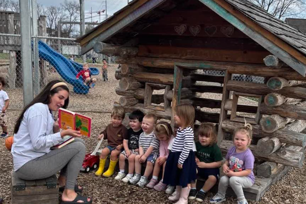 A child's mother reading to children at a Little Wonders Early Learning Center location. (Photo Courtesy of Little Wonders Early Learning Center)