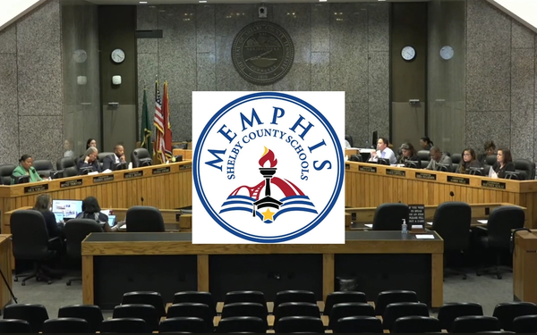 Commissioners sitting at a meeting with the logo of Memphis-Shelby County Schools