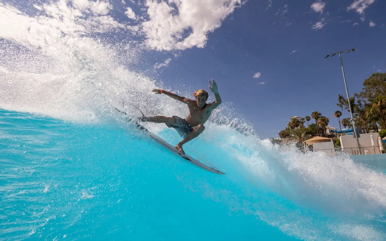 A turn off the top with the palms and the desert sky behind, which is the whole pitch of surfing in Palm Springs.