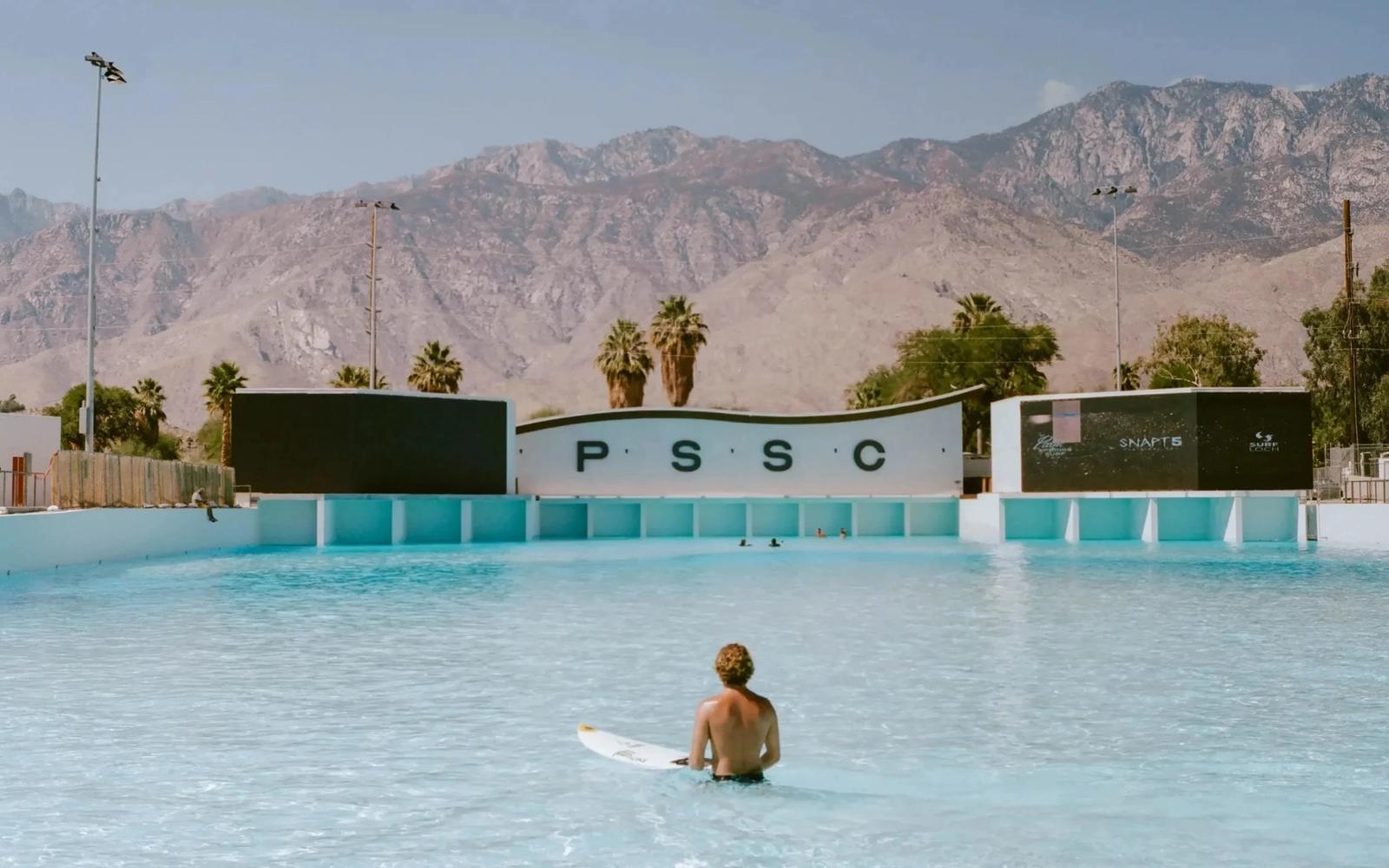 Surfer at Palm Springs Surf Club with the San Jacinto mountains behind