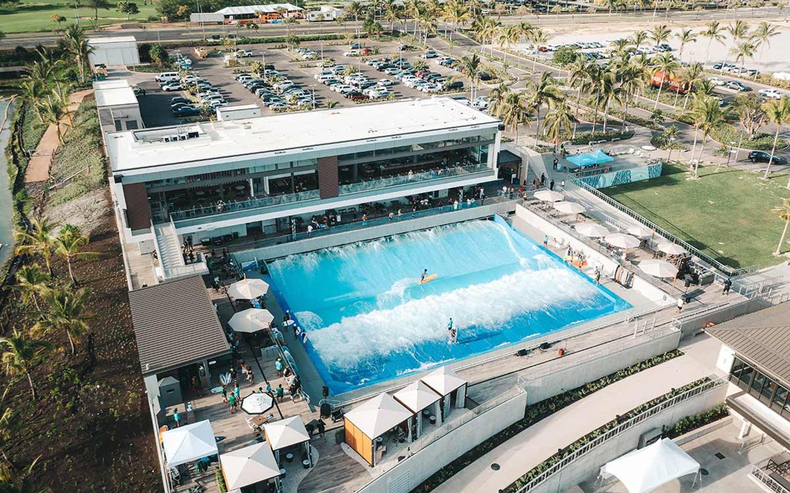 The LineUp at Wai Kai from above, with the wave pool beside the clubhouse and lagoon.