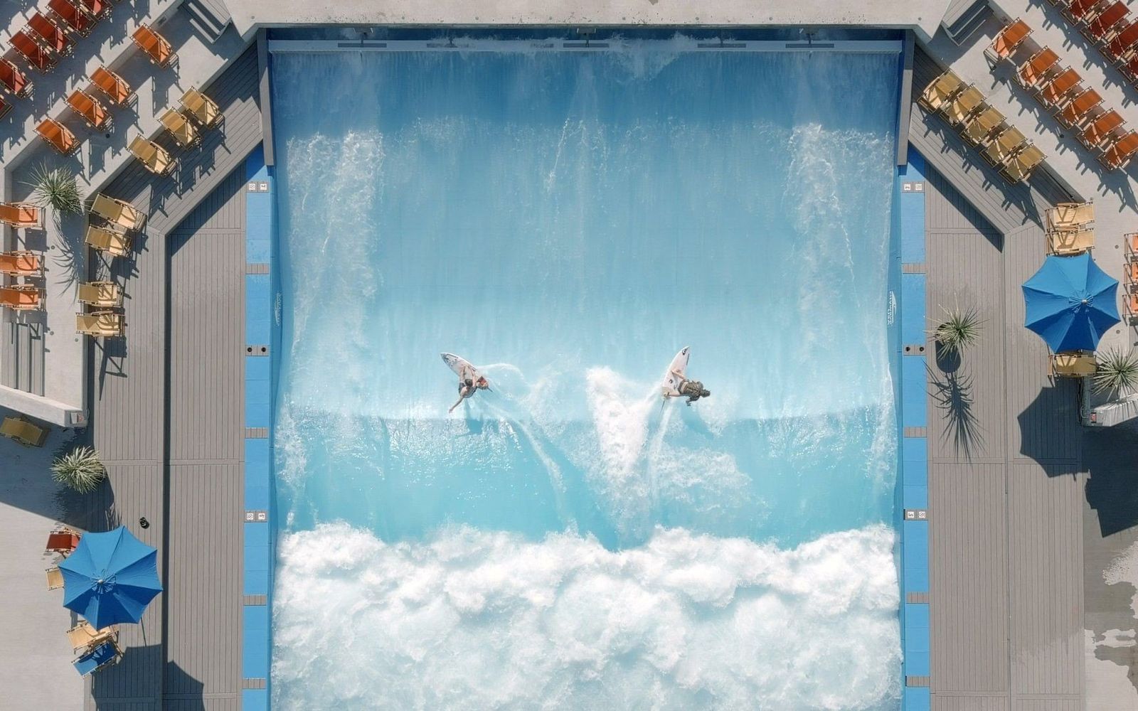 Lakeside Surf's standing wave from above, two surfers on the wave between the decks.
