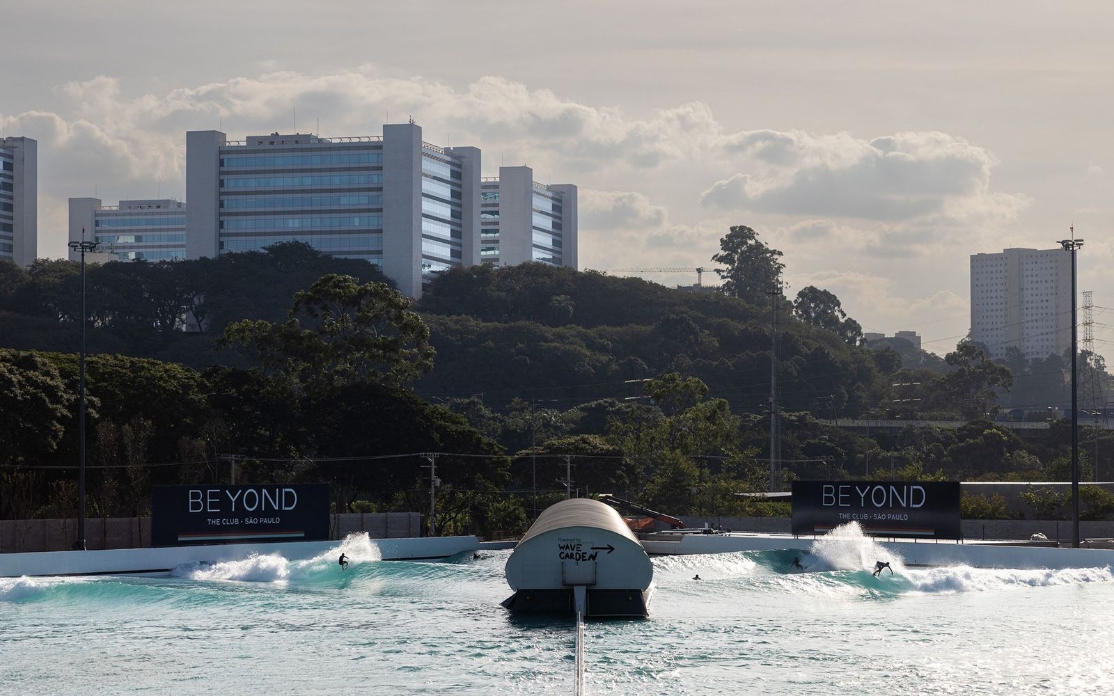 Beyond the Club's Cove in São Paulo, with the city's towers behind the lagoon.