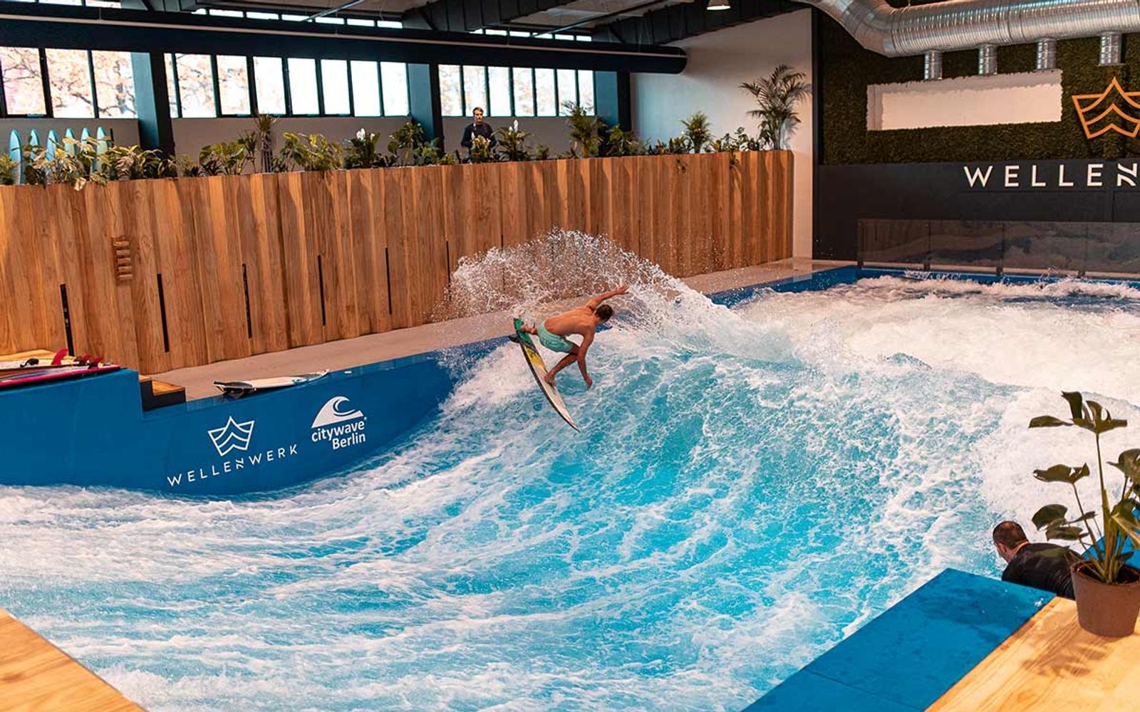 A surfer on the indoor wave at Wellenwerk in Berlin.
