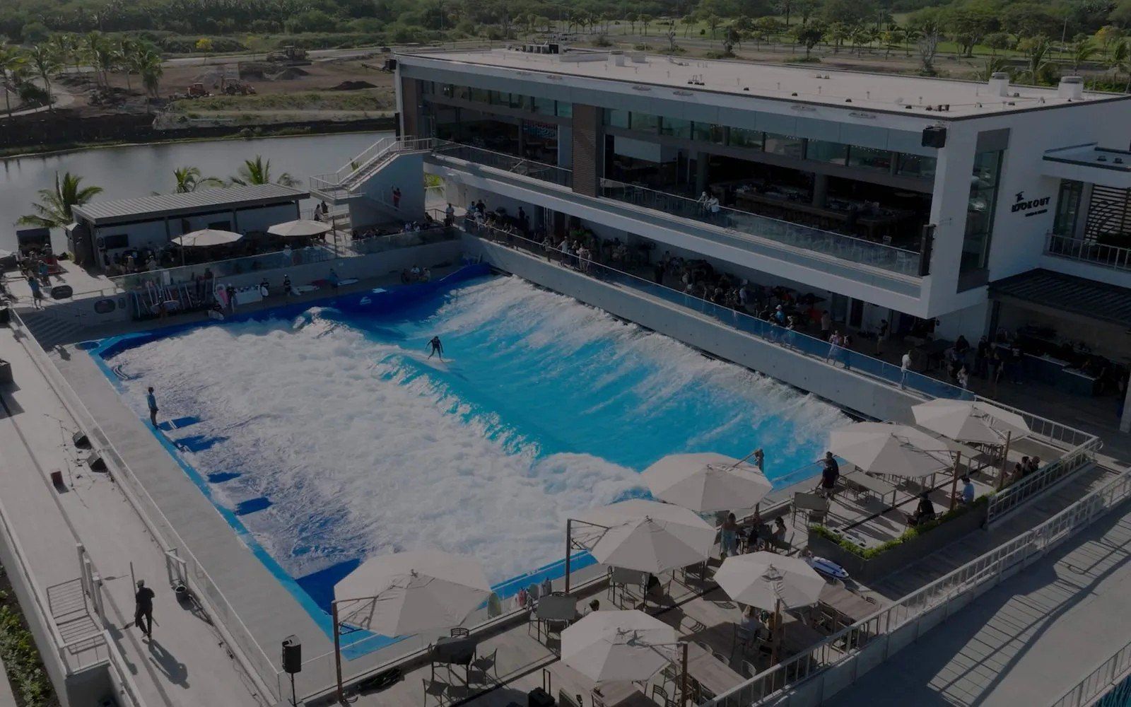The LineUp's standing wave beside the Wai Kai clubhouse, with the lagoon behind.