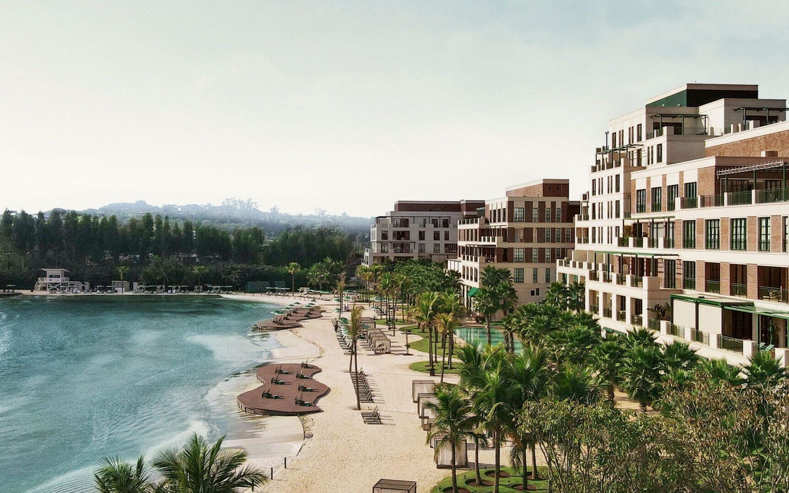 Boa Vista Village's beach and PerfectSwell lagoon, with residences along the shore.
