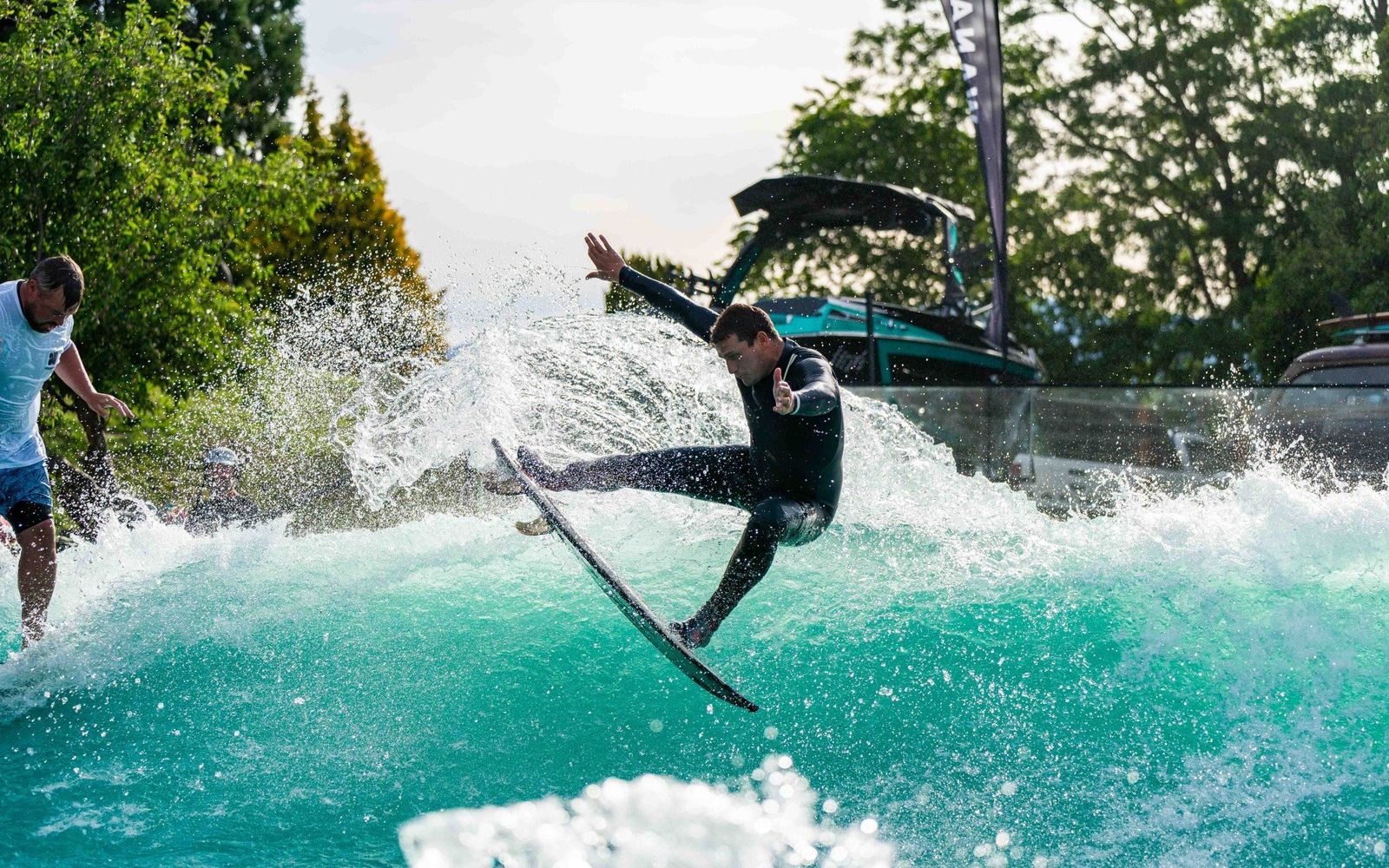 A surfer launching off the YourWave standing wave.