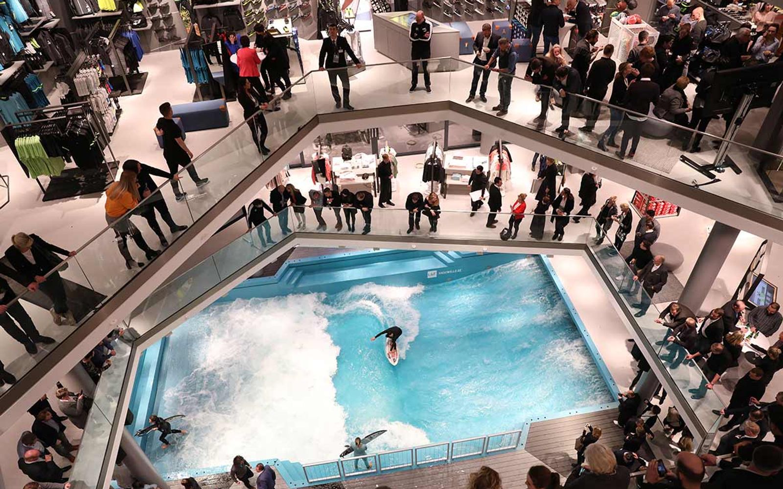 The Hasewelle from above, set into the atrium of the L&T department store with shoppers watching from the galleries.
