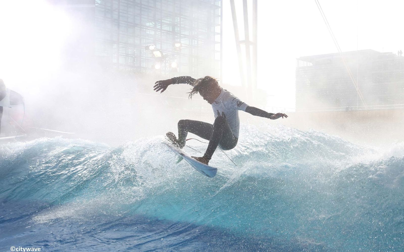 A surfer on the standing wave at citywave Tokyo Sakaimachi.