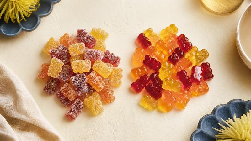 Two groups of gummies side by side for comparison, one sugared one glossy, overhead.