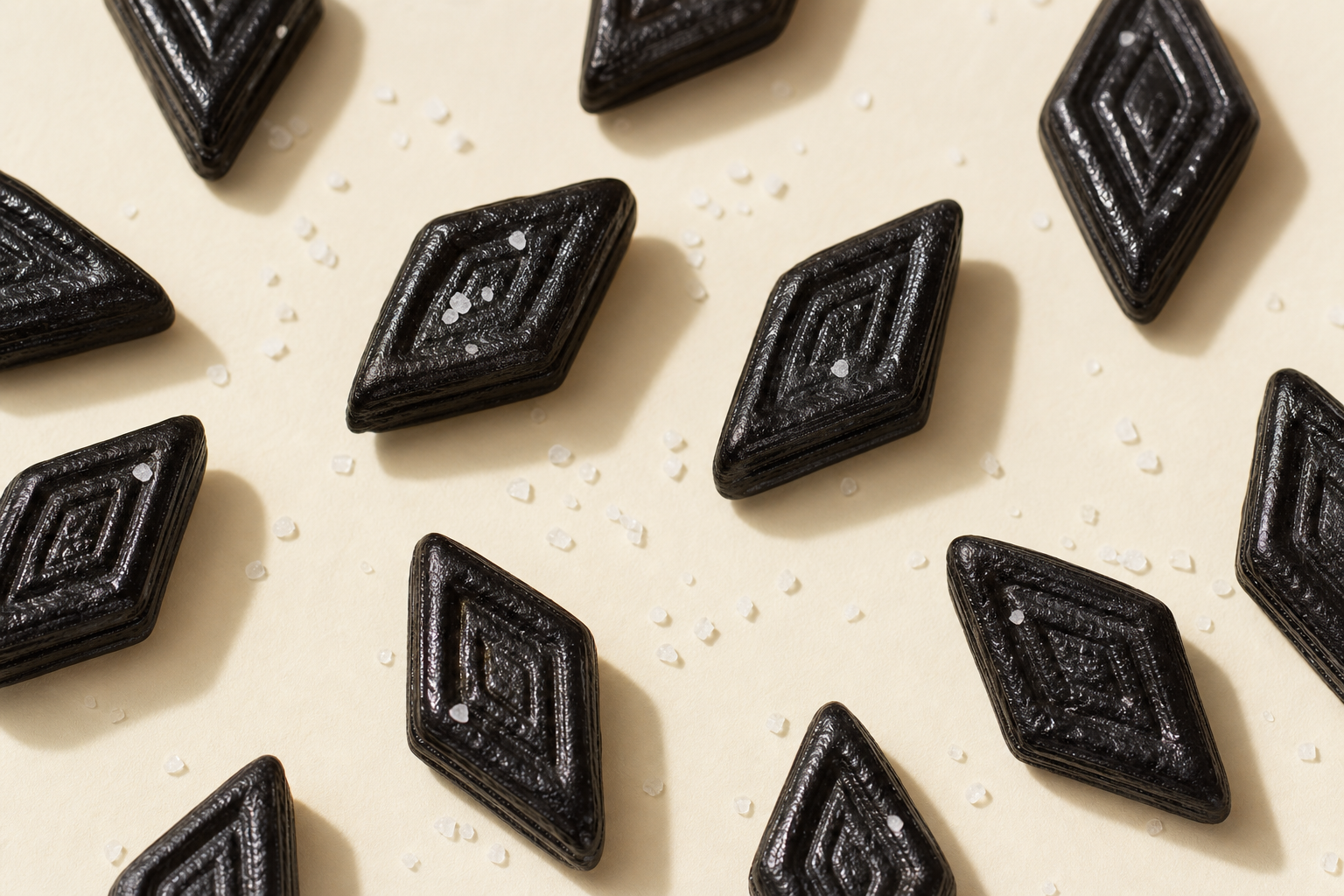 Black salty licorice (salmiak) pieces with salt