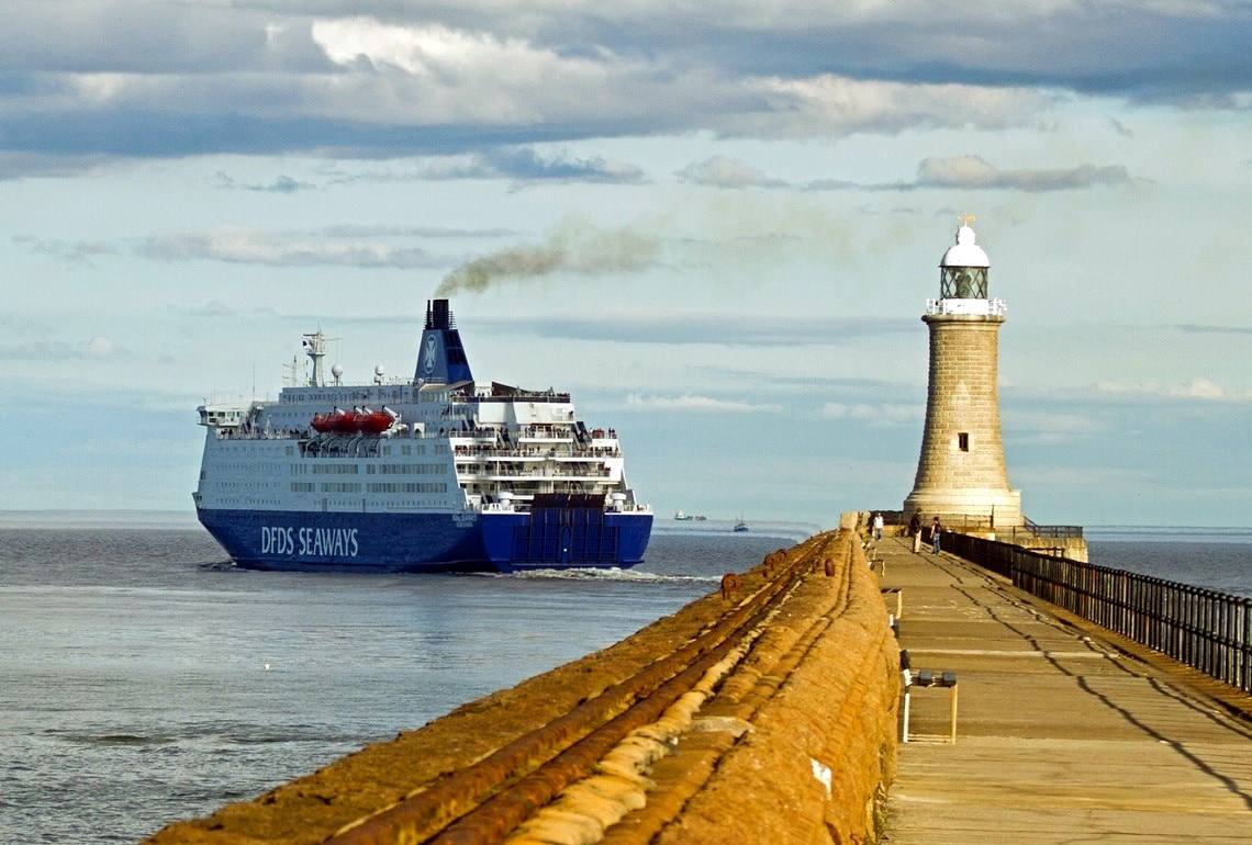 A DFDS ferry passing the lighthouse at the mouth of the Tyne
