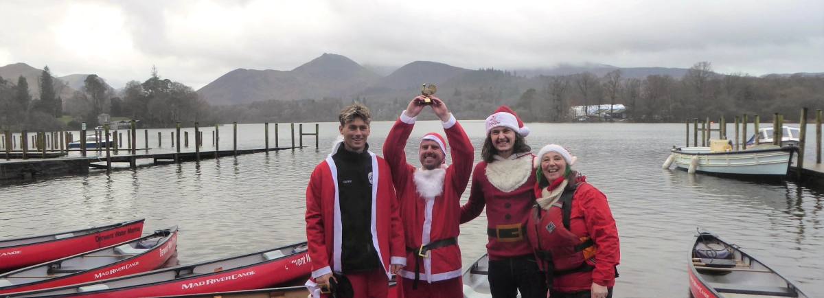 Santa Splash winners George Holder, Mel Swanwick and Jack Ellis from The Quiet Site and Vanessa Metcalfe, Keswick Tourism Association Tourism Manager