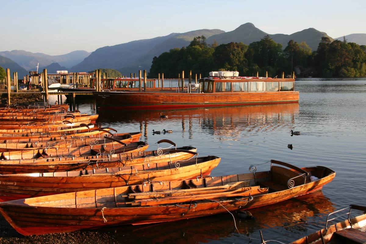 Wooden rowing boats drawn up at the Keswick boat landings