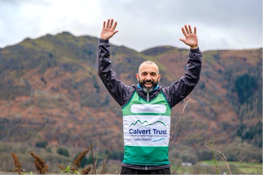 Runner wearing Calvert Trust running top