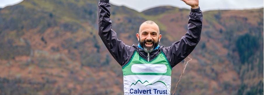 Runner wearing Calvert Trust running top