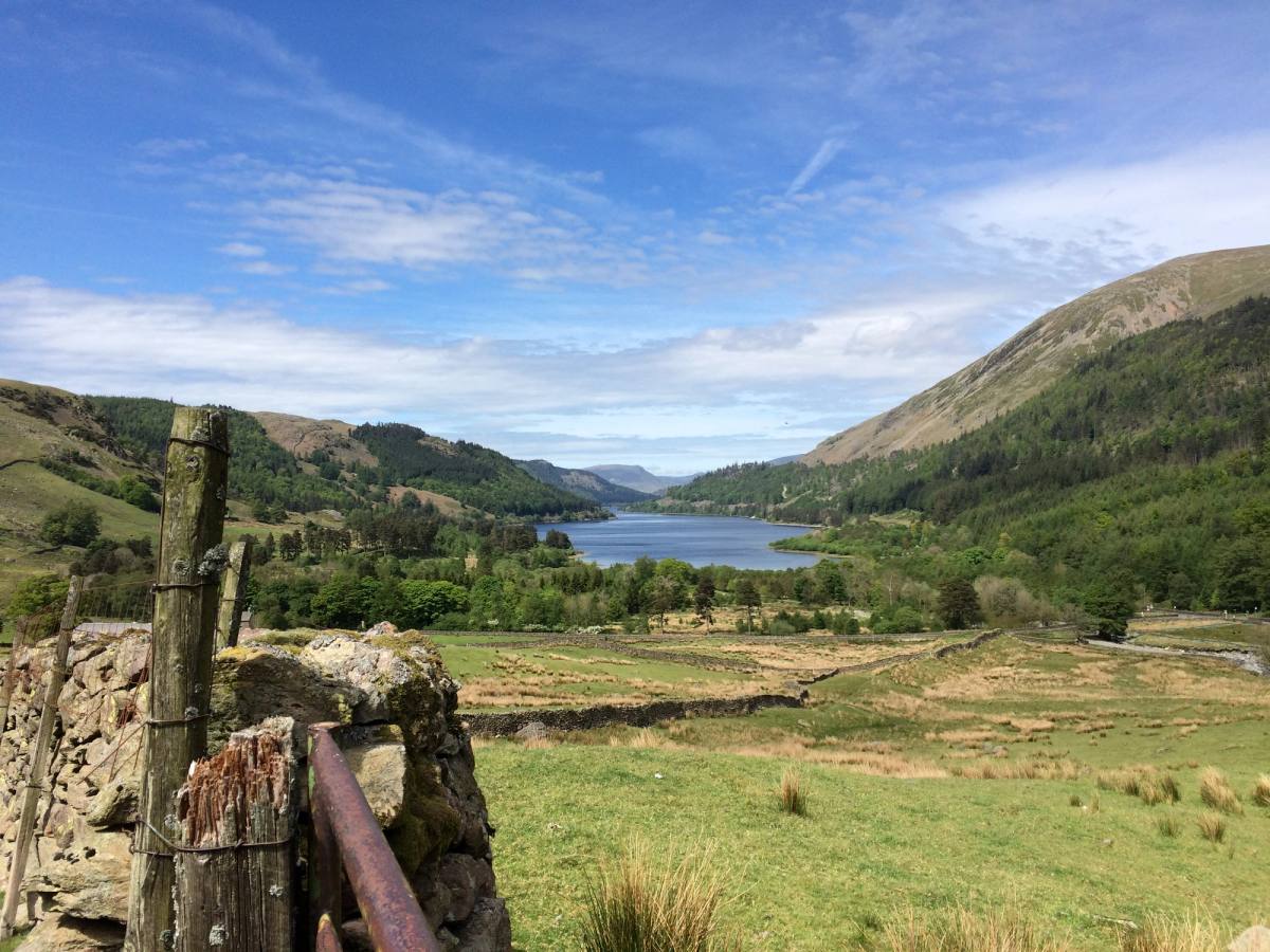 Thirlmere lying long and narrow between steep wooded fells