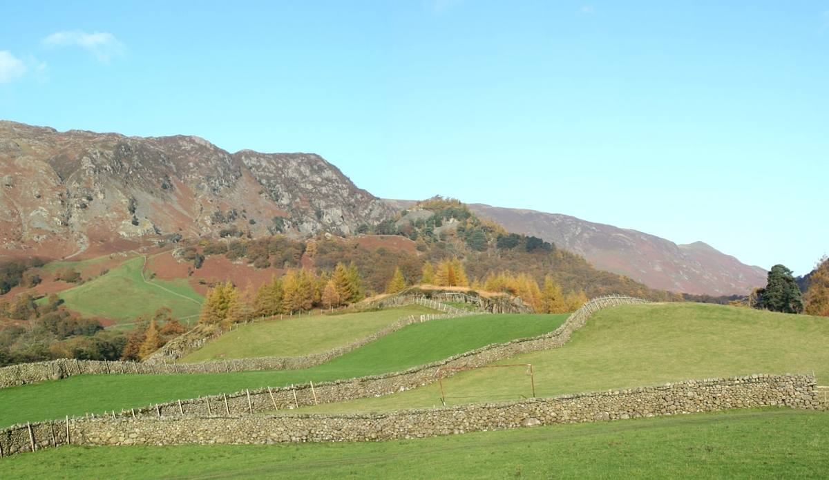 The Langstrath valley running back into the fells with autumn colour on the lower slopes