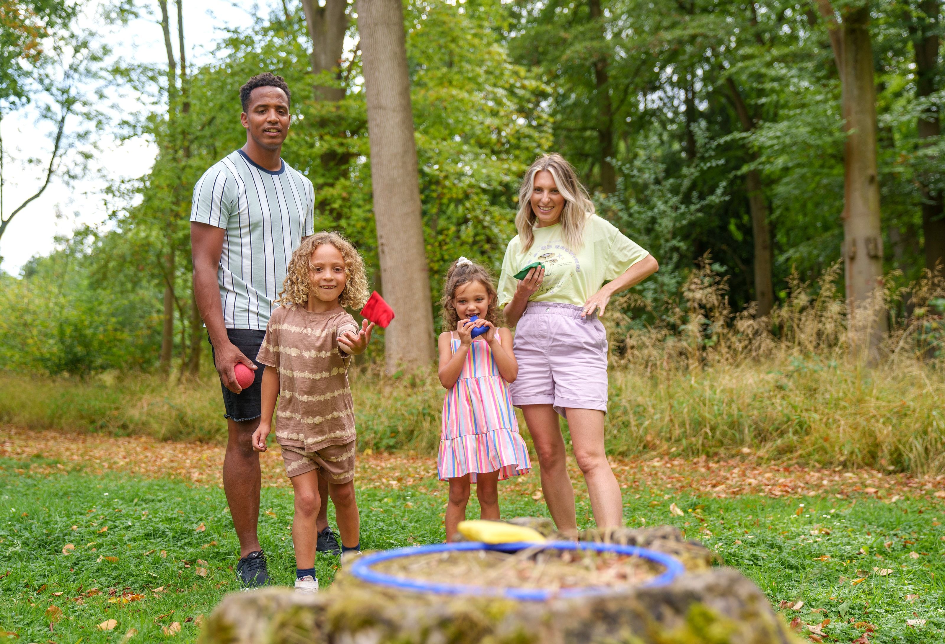 Family playing games in the forest
