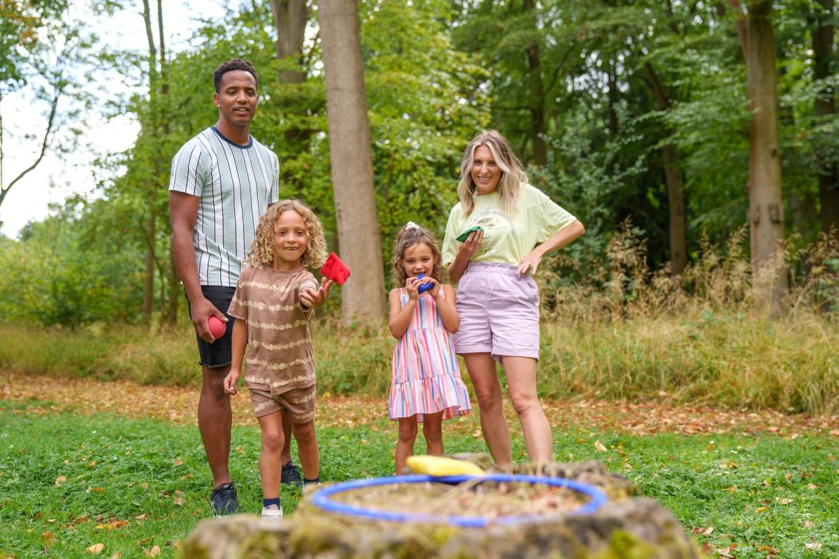 Family playing games in the forest