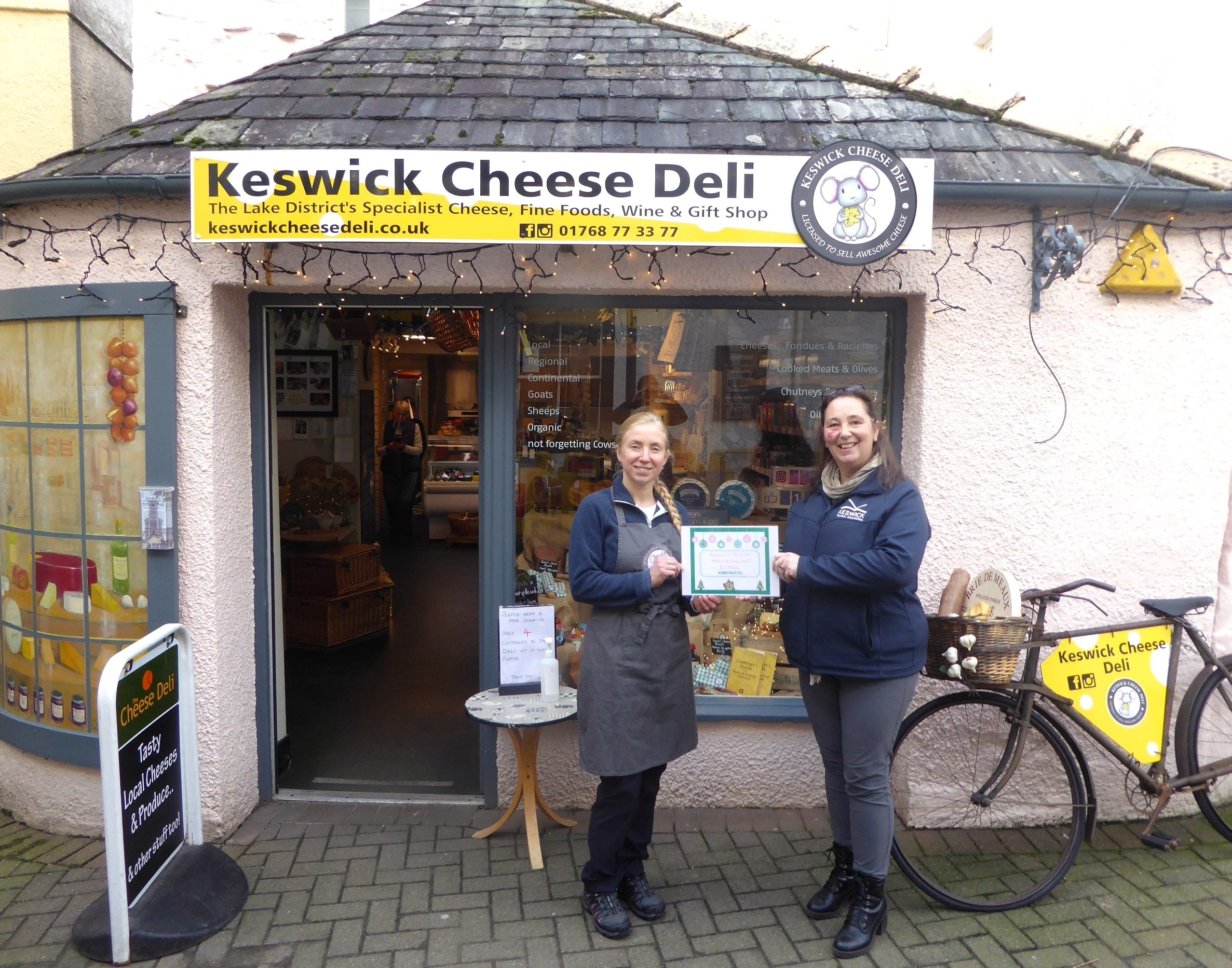 Hayley Peacock, owner of Keswick Cheese Deli being presented with the winners certificate by Vanessa Metcalfe, KTA Tourism Manager