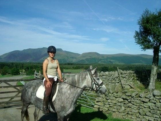 Lady riding a horse at Rookin House