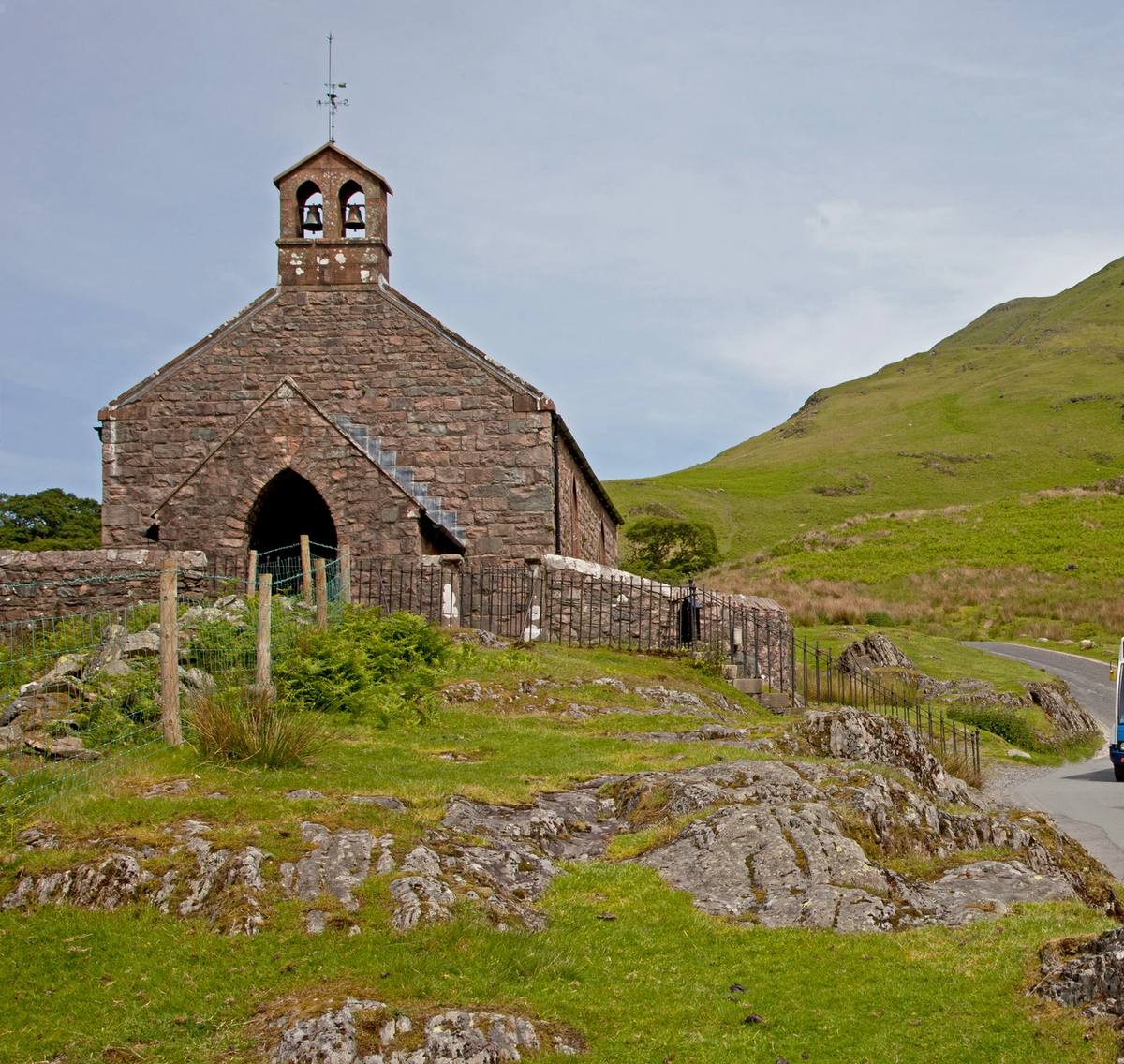 bus driving past st james church in buttermere