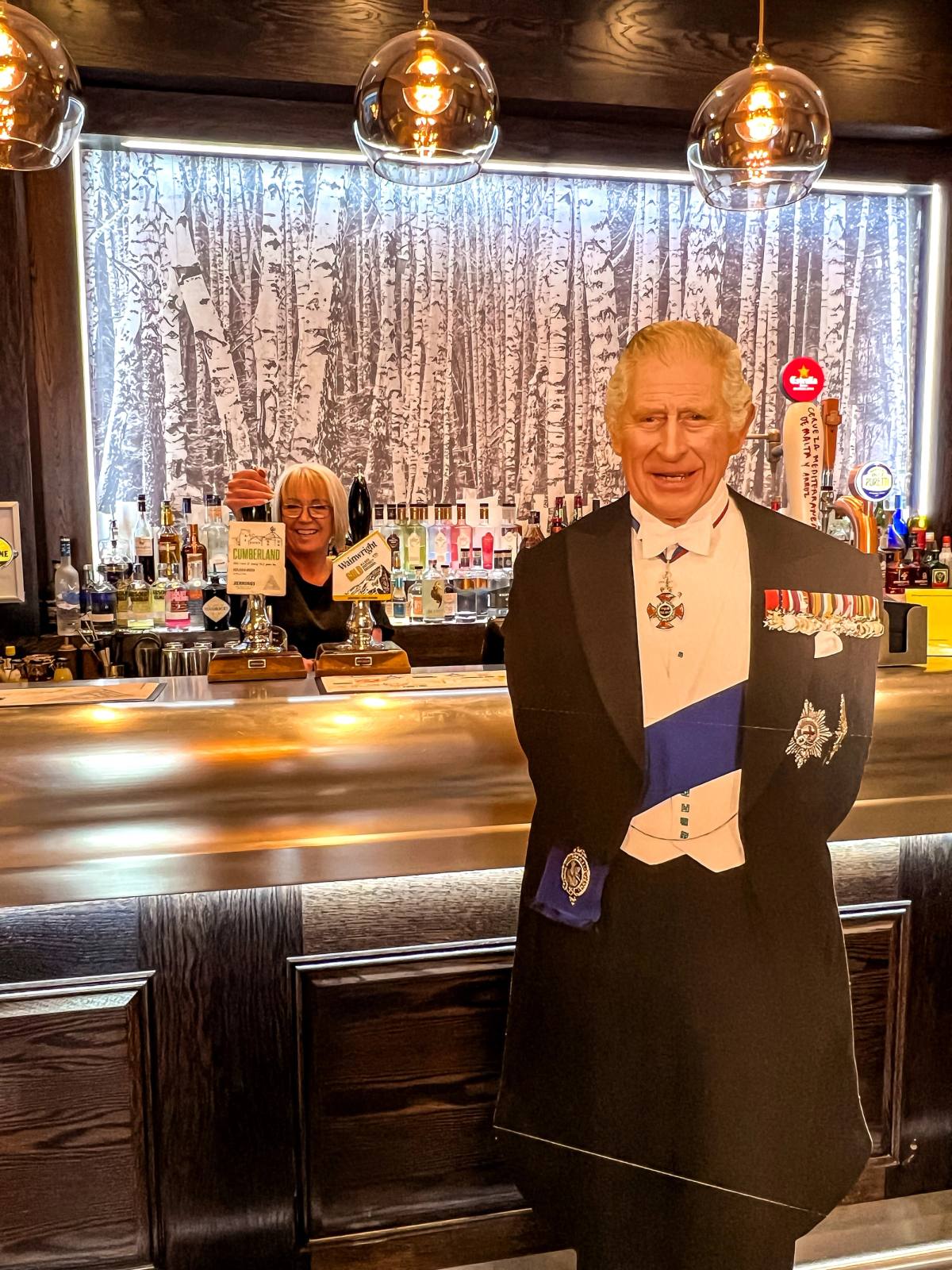Cut out of King Charles standing at the bar at the Inn on the Square