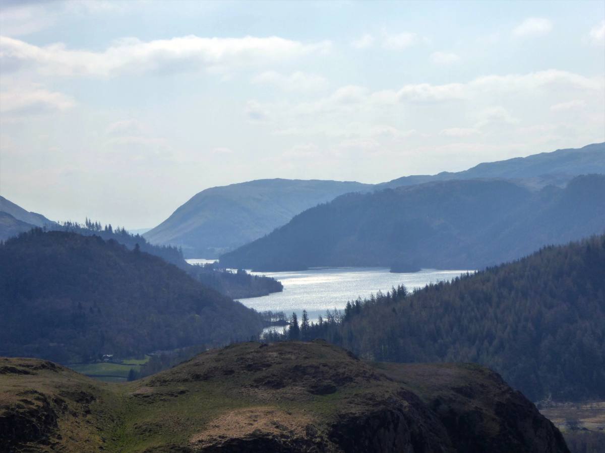 Thirlmere lying long and narrow between steep wooded fells