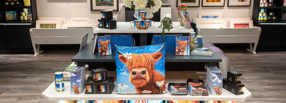 Inside the new gallery showing some of the paintings and other products