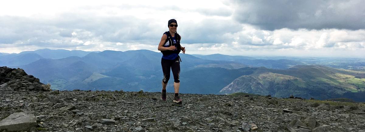 Runner heading for the summit of Skiddaw