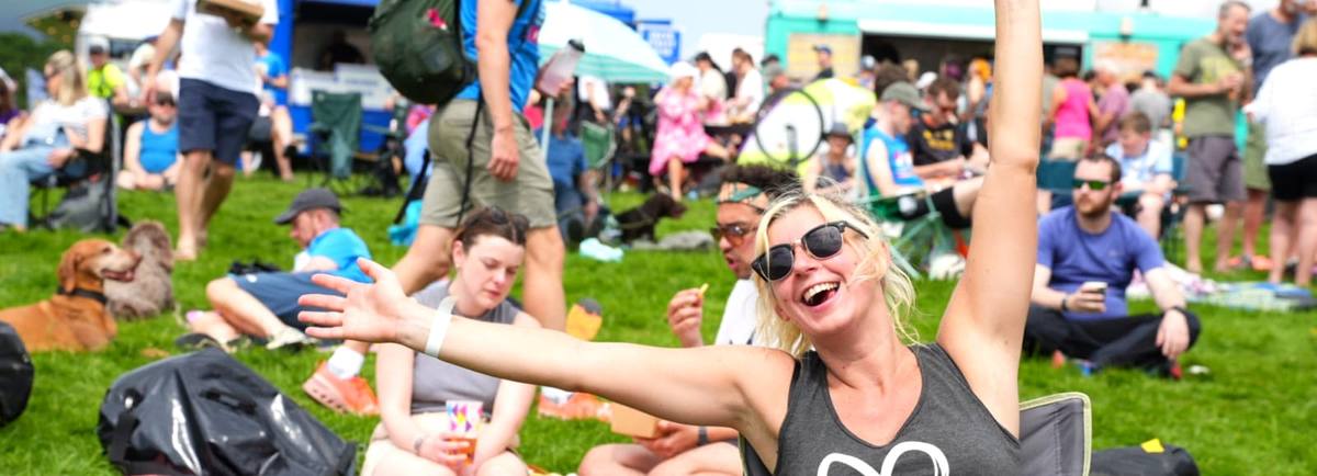 Relaxing in the Festival Village at KMF 2024