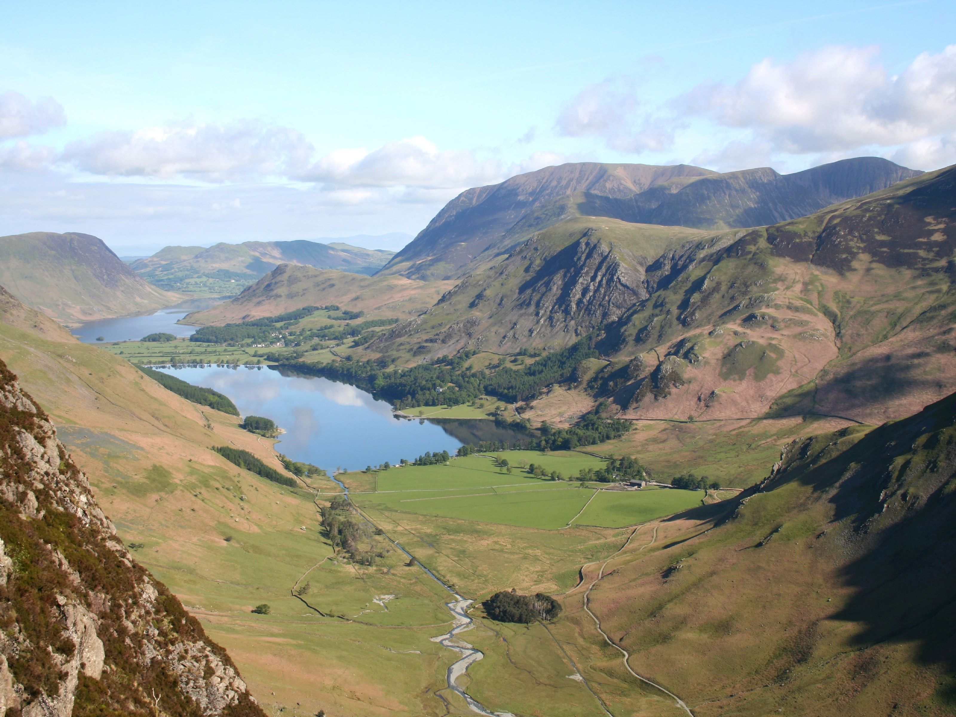 The Buttermere valley and lake seen from high on the fells with fields on the valley floor