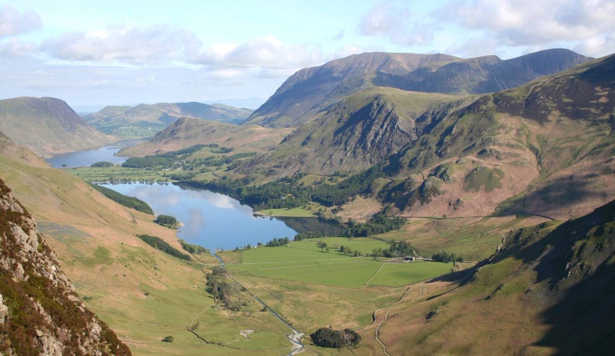 The Buttermere valley and lake seen from high on the fells with fields on the valley floor