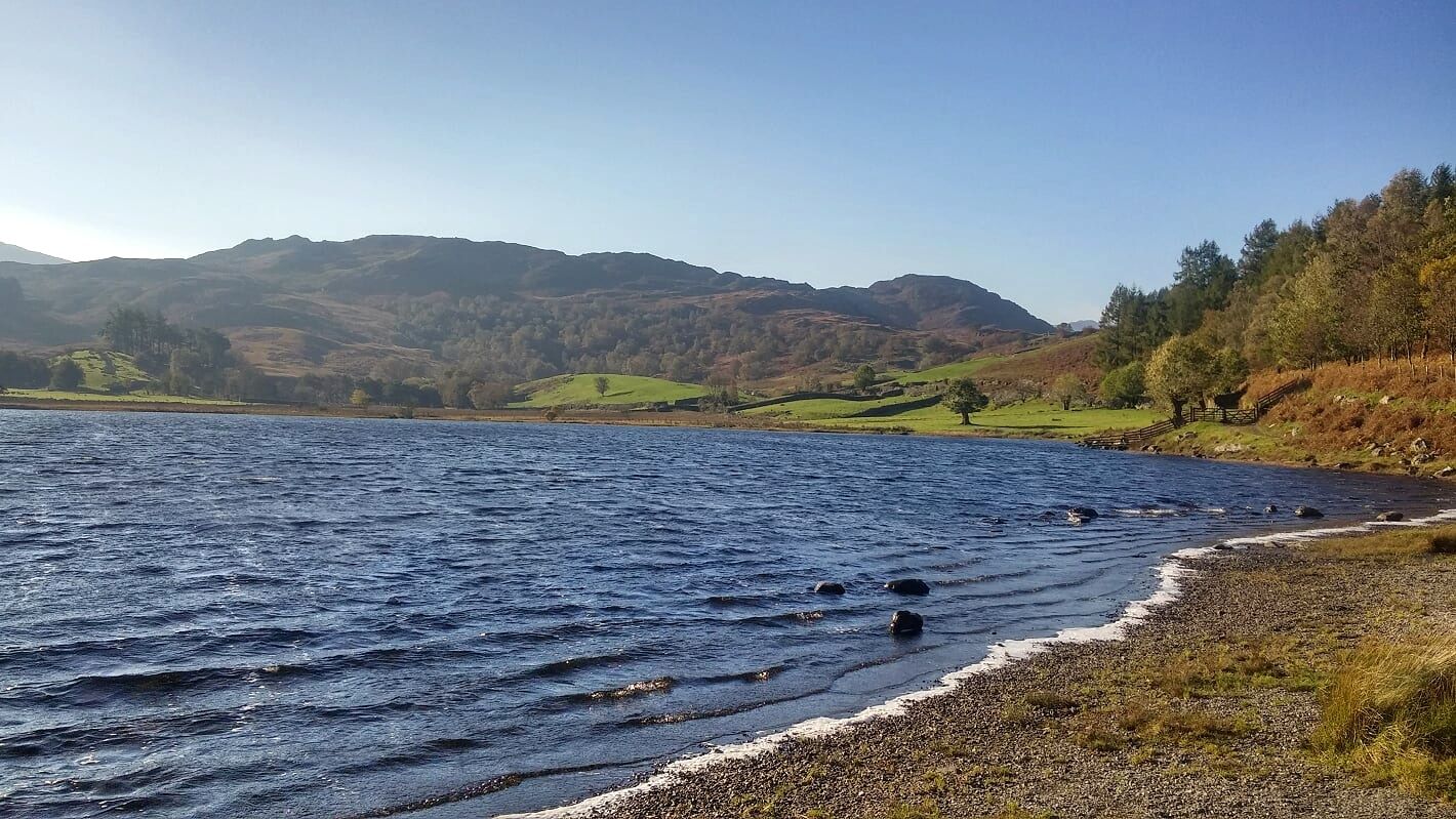 Wind on the surface of Watendlath Tarn with its shingle shore in the foreground
