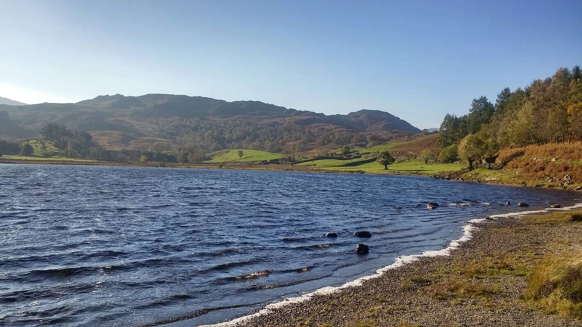 Wind on the surface of Watendlath Tarn with its shingle shore in the foreground