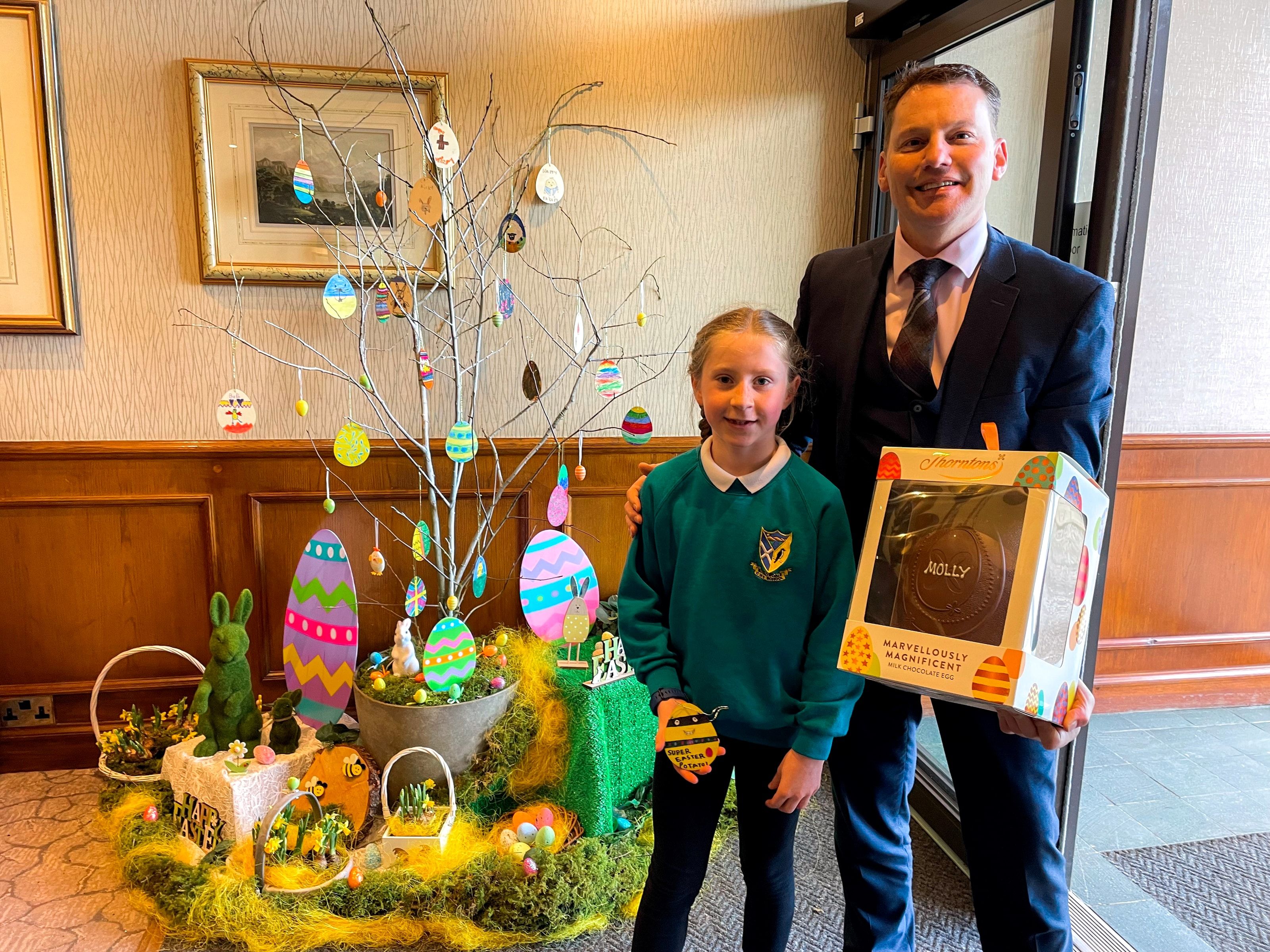 Marcell Cilliers, General Manager of the Lodore Falls Hotel & Spa and Molly Edmondson, competition winner from Borrowdale School