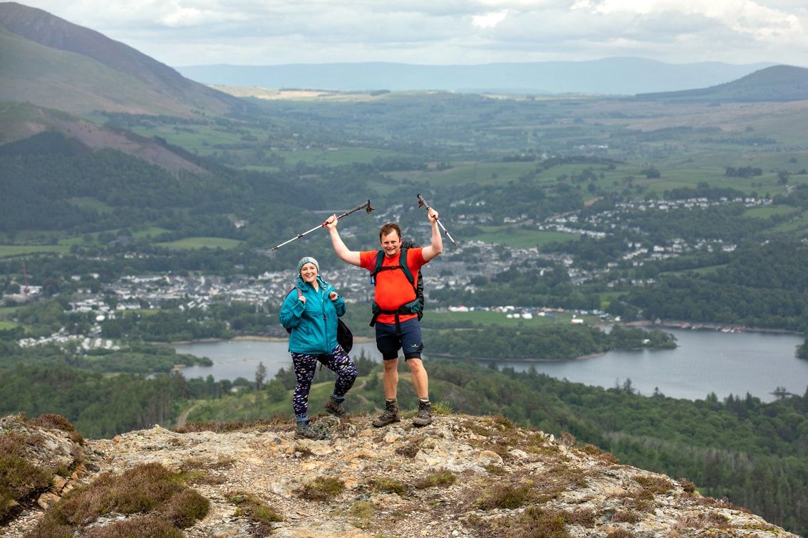 Walkers with the fesitval village below