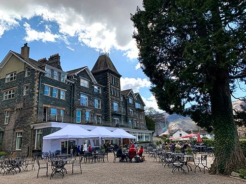 Guests taking advantage of weatherproof outdoor dining available at the Lodore Falls Hotel & Spa