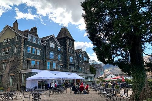 Guests taking advantage of weatherproof outdoor dining available at the Lodore Falls Hotel & Spa